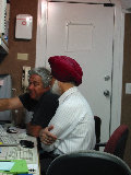 Jon Lutz and Abnash Singh at the S-Pol engineering displays. (R.Rilling, 2002-May-13)