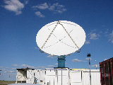 S-Pol performing a solar calibration.  Note the shadow of the feedhorn located in the center of the S-Pol dish. (R.Rilling, 2002-May-13)