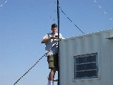 J. Pinto fixing radio internet dish. (J.Pinto, 2002-Jun-13)