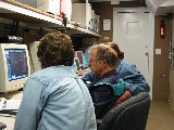Rita Roberts, Jim Wilson and Crystal Pettet work in the SCC during IHOP. (R.Rilling, 2002-May-13)