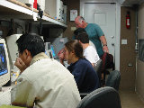 Guifu Zhang studies RAP's CIDD display. (R.Rilling, 2002-May-26)