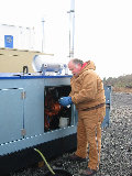 Al Phinney changing the oil in the S-Pol generator. (R.Rilling, Nov-2001)