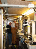 Noise calibration work in the S-Pol transmitter van. Rotary switch (Mitch Switch) in foreground.  Workers: Phinney and Ferraro. (R.Rilling, Dec-2001)