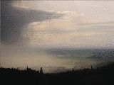 A shower over the valley to the west of the S-Pol site. (R.Rilling, Dec-2001)