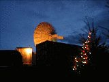 The radar at night.  Peggy Taylor's Christmas tree in foreground. (R.Rilling, Dec-2001)